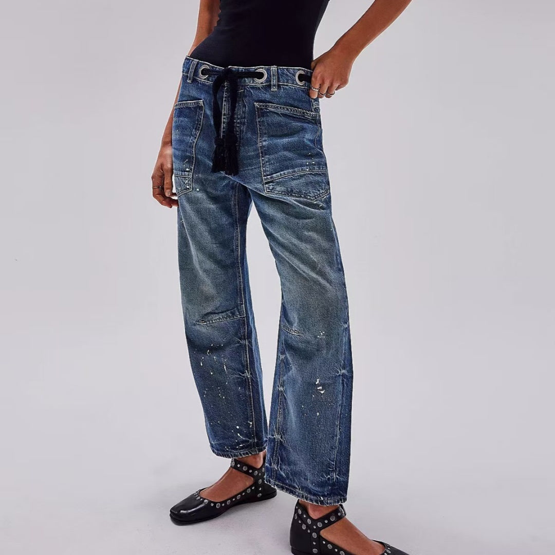 Jeans soltos de cordão de tinta de respingo com reviravolta casual artística