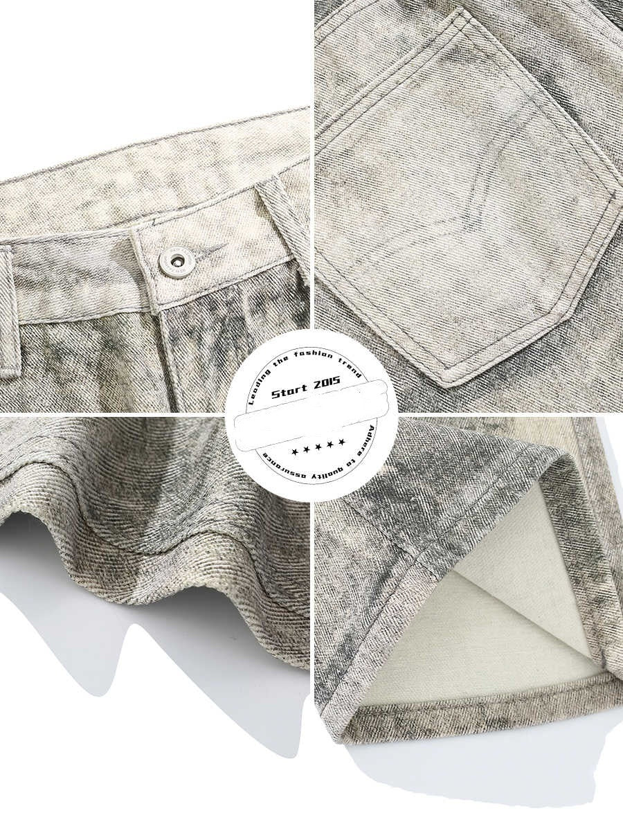 Jeans usang dasi-di-peper dengan sedikit pelukan dan lubang vintage